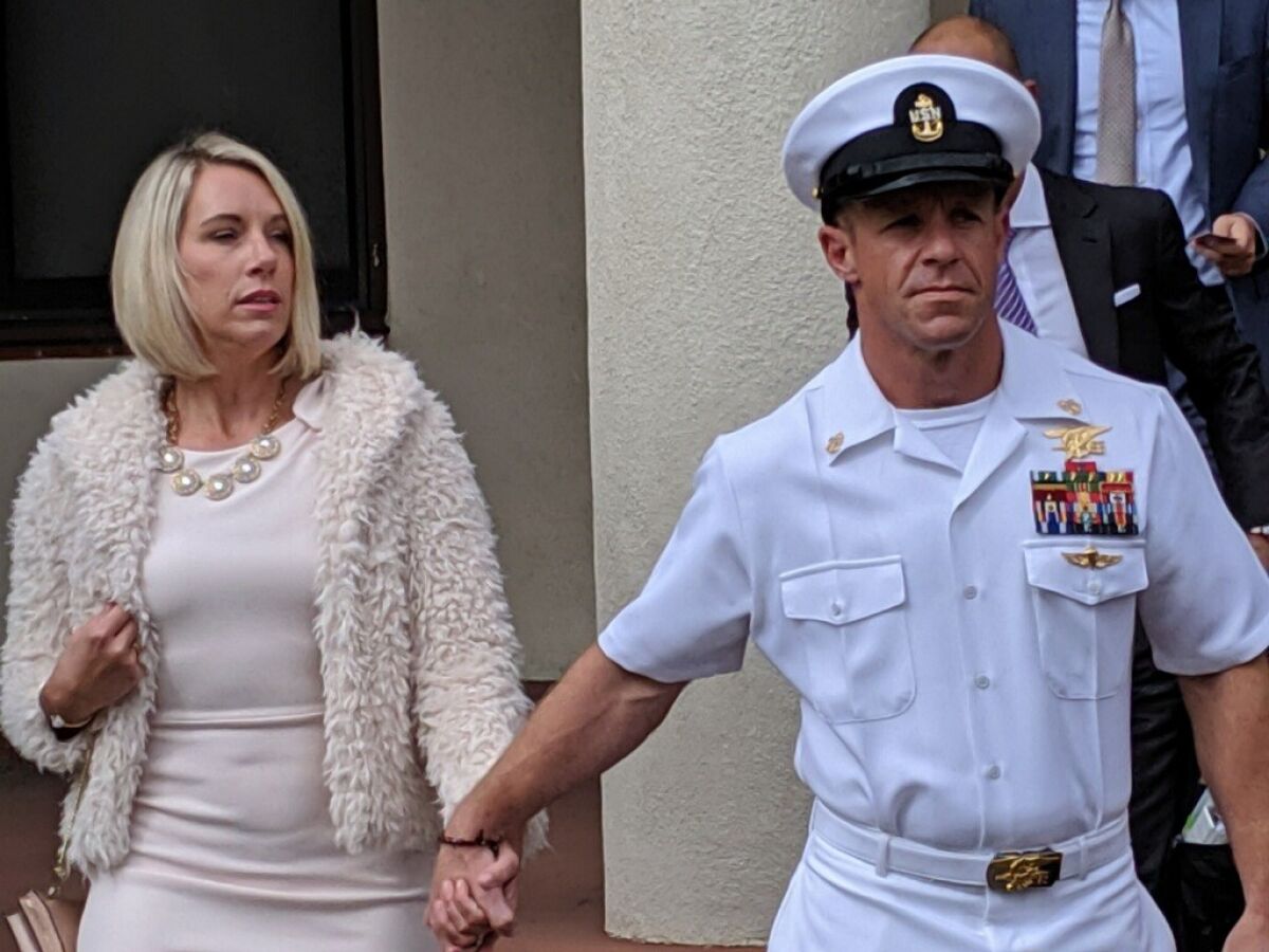 Navy SEAL Chief Edward R. Gallagher and his wife Andrea Gallagher leave the courthouse Monday, the start of his second week of trial.