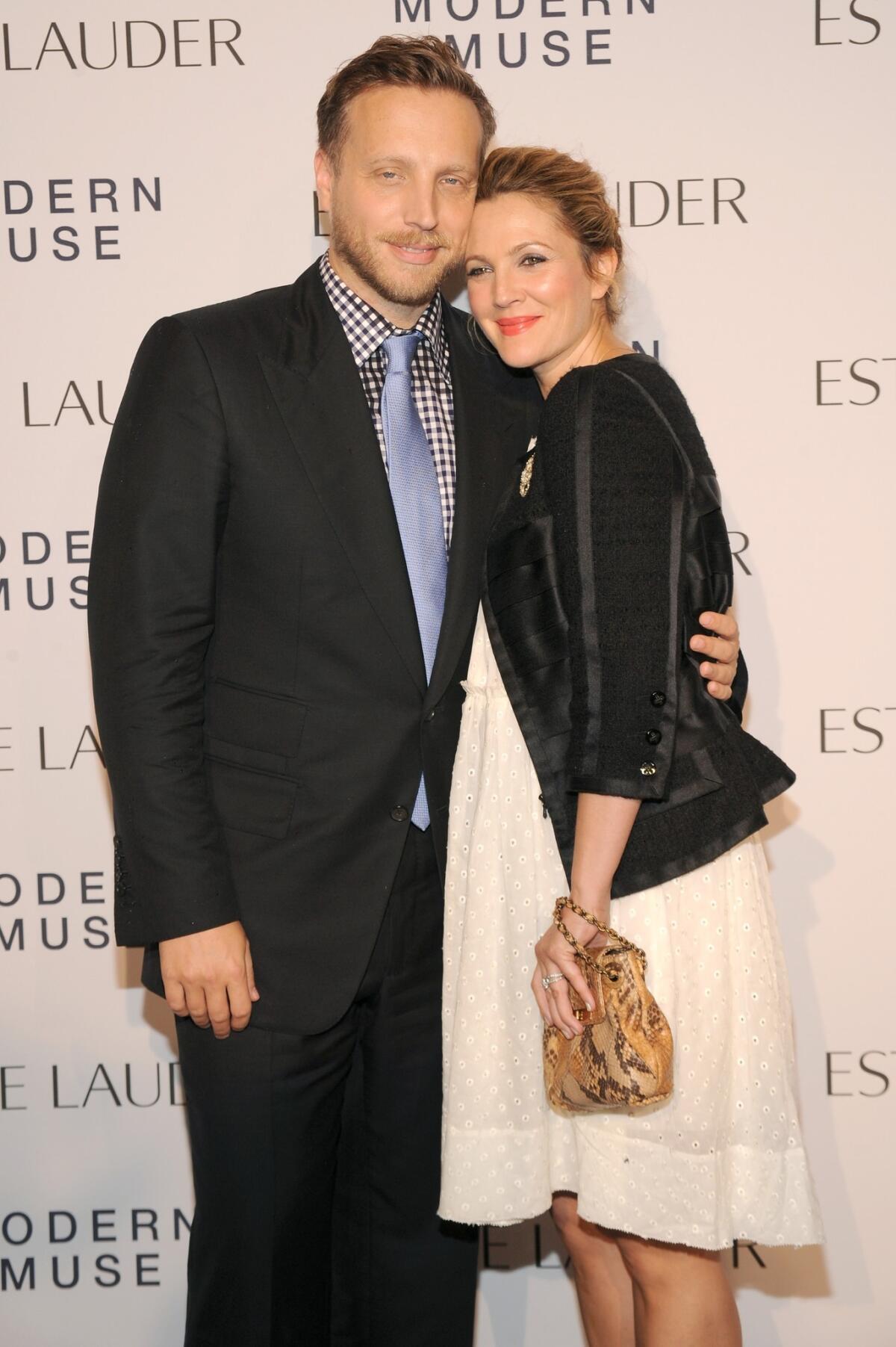 Actress Drew Barrymore is all smiles with Ariel Foxman at the Estee Lauder Modern Muse fragrance launch party at the Guggenheim Museum. [For the record: 2:35 p.m. Sept. 13: An earlier version of this caption misidentified Foxman as Barrymore's husband, Will Kopelman.]