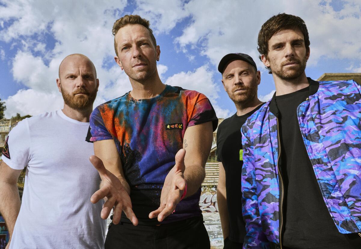 Will Champion, from left, Chris Martin, Jonny Buckland and Guy Berryman of Coldplay.