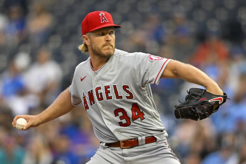 Los Angeles Angels starting pitcher Noah Syndergaard delivers to a Kansas City Royals batter during the first inning of a baseball game, Monday, July 25, 2022, in Kansas City, Mo. (AP Photo/Reed Hoffmann)