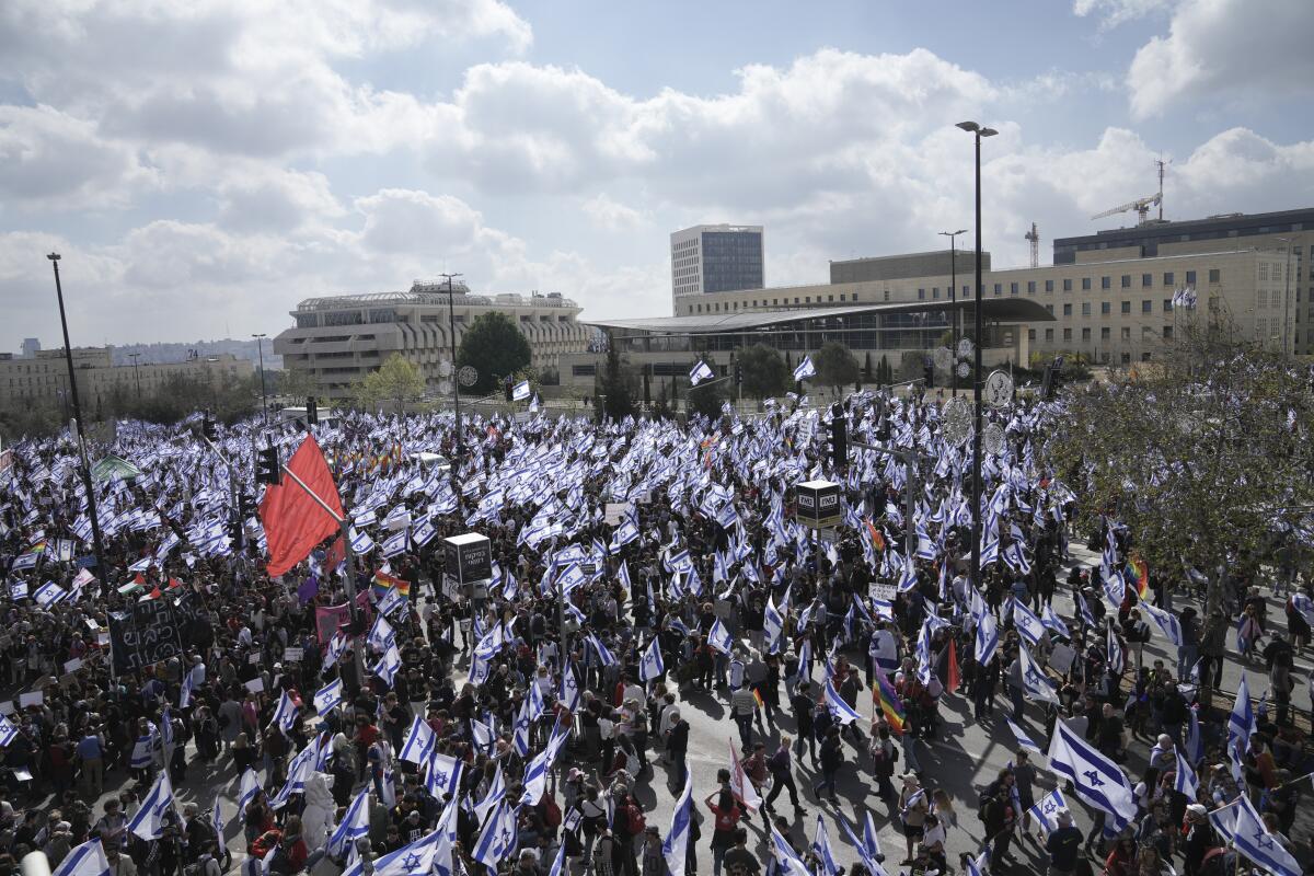 Israelis protest against Prime Minister Benjamin Netanyahu's judicial overhaul plan outside the parliament in Jerusalem.