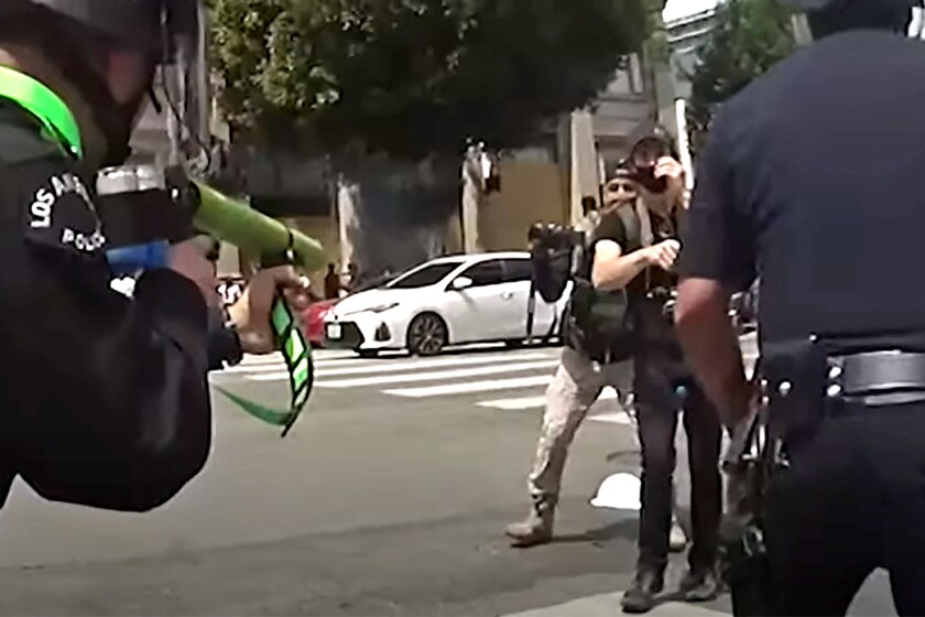 Two more reports find fault in LAPD's handling of summer
protests 2 Newly-released body-camera footage from protests in Los Angeles this summer shows Los Angeles police officers yank a large protest sign from the hands of a man in a Hollywood intersection, shove him backwards as he puts his hands up, then shoot him in the groin with a projectile at close range.