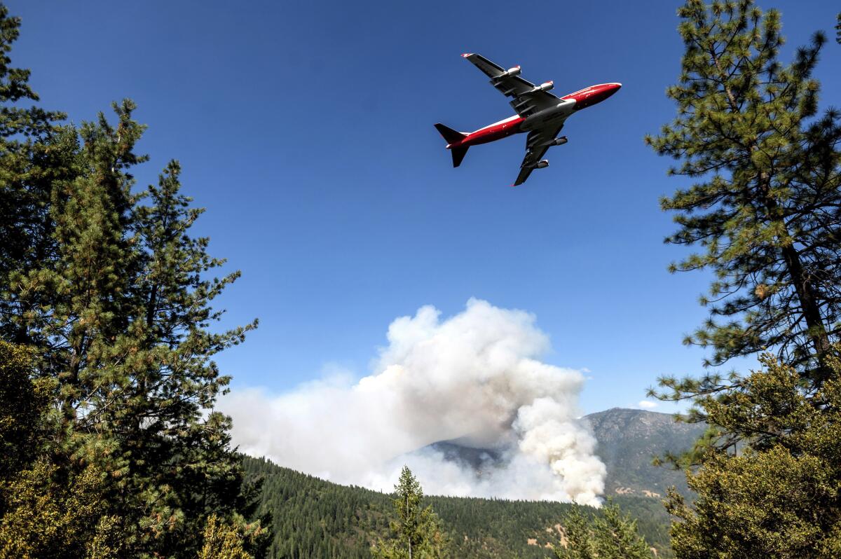 An air tanker prepares to drop retardant while battling the August Complex fire in the Mendocino National Forest.