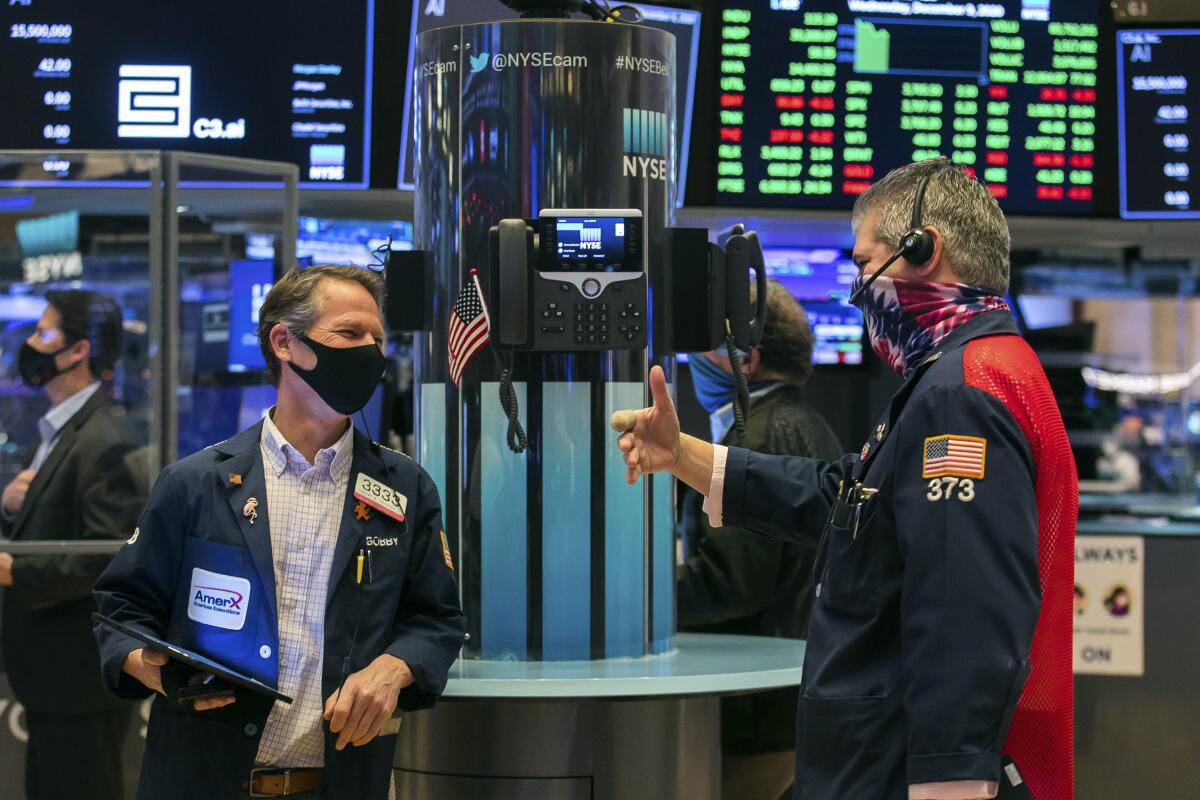 Traders Robert Charmak and John Panin at the New York Stock Exchange