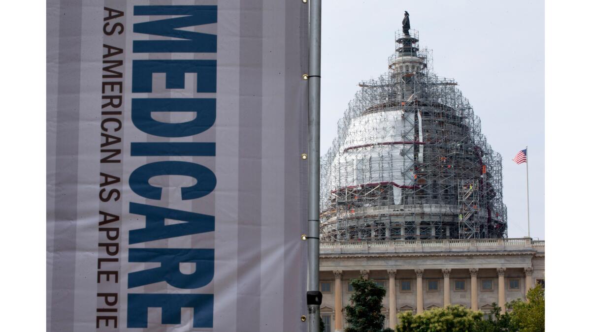 A sign supporting Medicare is seen on Capitol Hill in Washington last year.