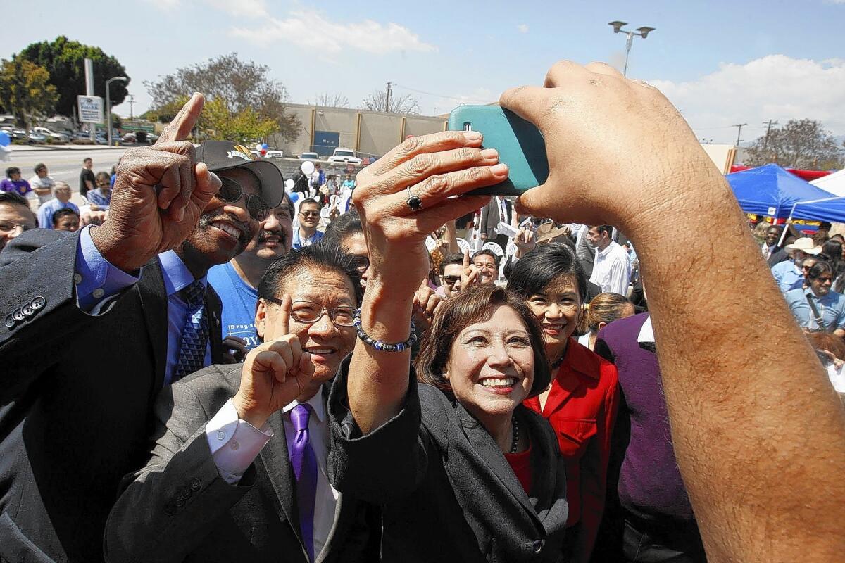 Hilda Solis takes a photo with supporters during a rally at her campaign headquarters in El Monte. She is seeking to succeed Gloria Molina on the L.A. County Board of Supervisors.