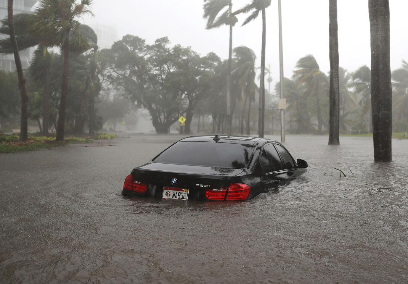 A car is seen in a flooded street as Hurricane Irma passes through Miami on Sept. 10, 2017.