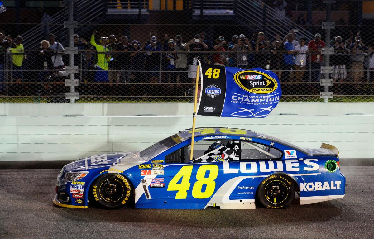 Jimmie Johnson, driving his No. 48 Lowe's Chevrolet, celebrates at Homestead-Miami Speedway after winning the NASCAR Sprint Cup Series Ford EcoBoost 400 and the 2016 NASCAR Sprint Cup Series Championship on Sunday.