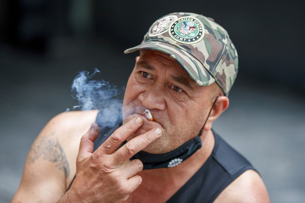 Man smoking a cigarette in Auckland, New Zealand