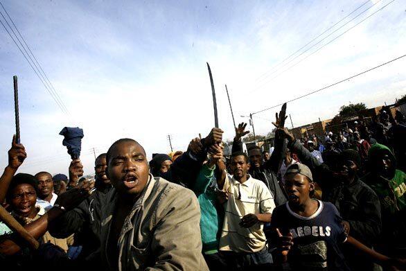 Rioters surge through Reiger Park outside Johannesburg, South Africa.
