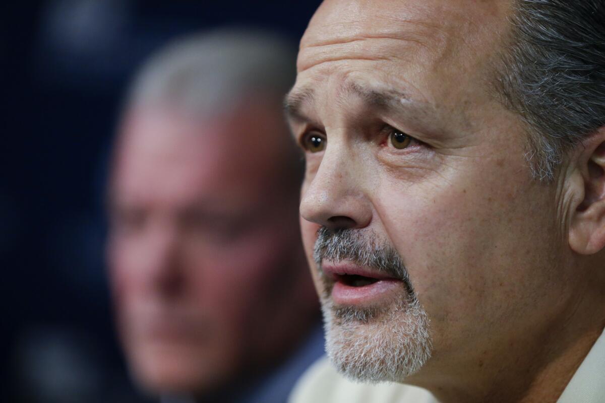 With team owner Jim Irsay looking on, Indianapolis Colts Coach Chuck Pagano speaks after the announcement of his new contract on Monday.