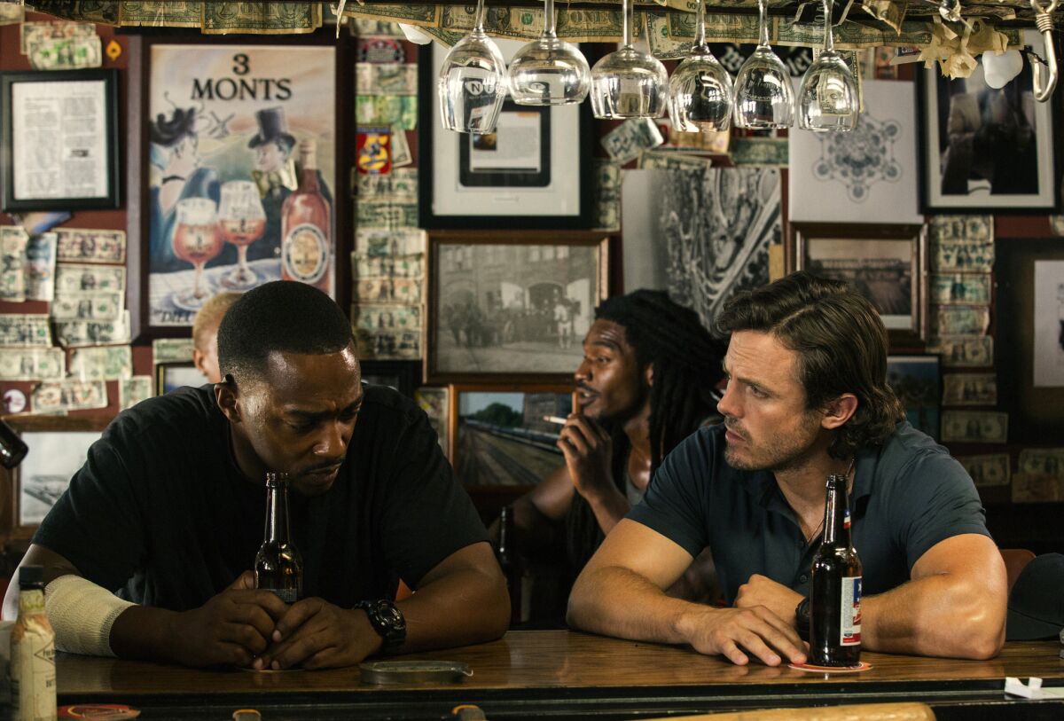 Anthony Mackie, left, and Casey Affleck in a scene from "Triple 9."