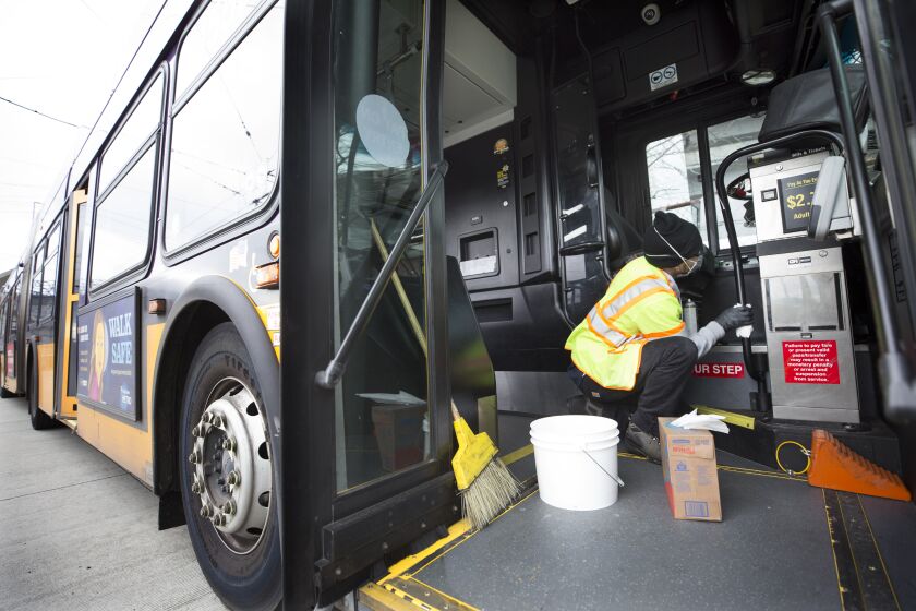 SEATTLE, WA - MARCH 03: Tyler Goodwin, a utility service worker for King County Metro Transit, deep cleans a bus as part of its usual cleaning routine at the King County Metro Atlantic/Central operating base on March 3, 2020 in Seattle, Washington. Buses are deep cleaned every 30 days but later today Metro plans to ramp up their efforts to super clean buses to prevent the spread of the novel coronavirus, COVID-19 outbreak. (Photo by Karen Ducey/Getty Images)