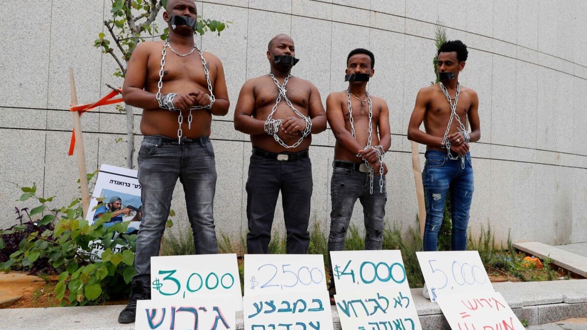 African migrants demonstrate in Tel Aviv against the Israeli government's policy to forcibly deport African refugees and asylum seekers to Rwanda and Uganda.