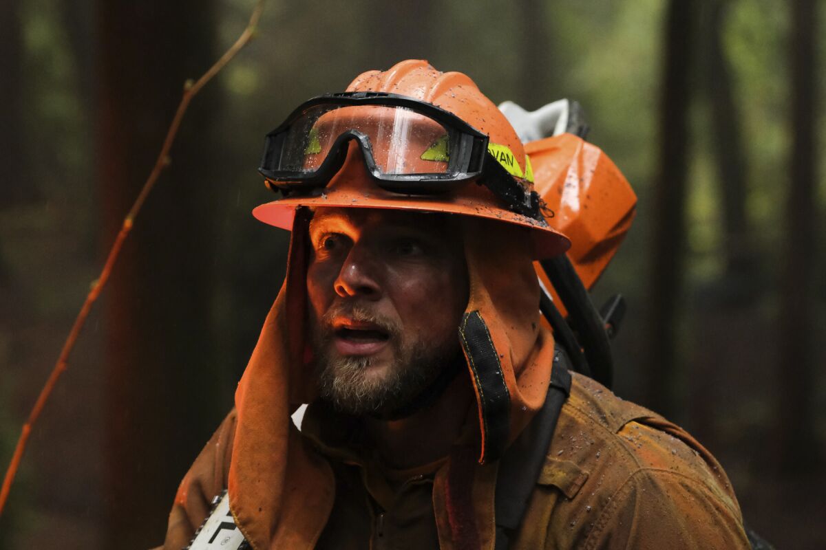 A man in firefighting gear.