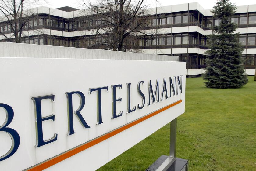 FILE - This March 13, 2003 file photo shows an outside view of the German media giant Bertelsmann in Guetersloh, Germany. U.S. regulators are suing to block a $2.2 billion book publishing deal that would have reshaped the industry, saying consolidation would hurt authors and readers. German media giant Bertelsmann’s Penguin Random House, already the largest American publisher, wants to buy New York-based Simon & Schuster, whose authors include Stephen King, Hillary Clinton and John Irving, from TV and film company ViacomCBS. (AP Photo/Michael Sohn, File)