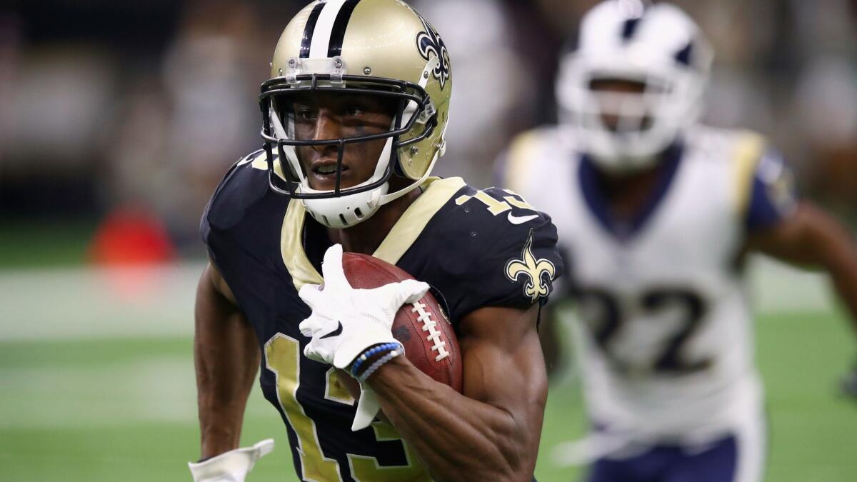 New Orleans Saints' Michael Thomas runs for a touchdown during the fourth quarter against the Rams on Sunday.