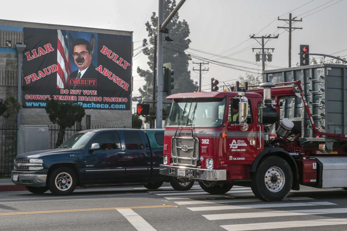 A banner calling Baldwin Park Councilman Ricardo Pacheco a liar and a bully hangs from Albert Ehlers' business on Ramona Boulevard.
