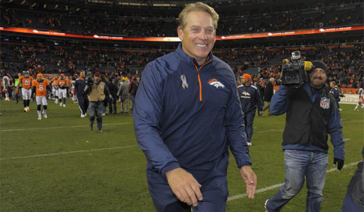 Denver Broncos interim Coach Jack Del Rio walks off the field after a 27-17 victory over the Kansas City Chiefs on Sunday night.