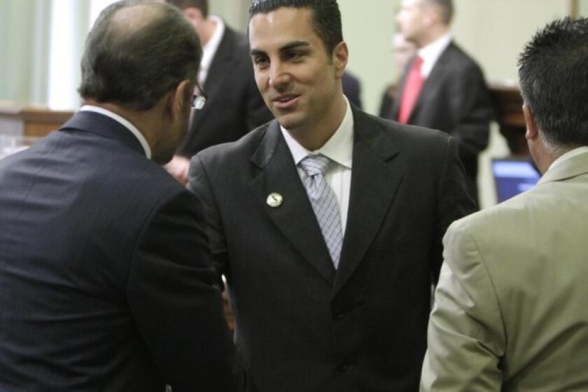Mike Gatto (D-Silver Lake)receives congratulations after he was sworn in to the Assembly in 2010.