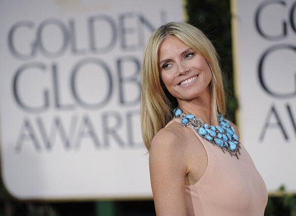 Heidi Klum's turquoise jewelry saves her nude Calvin Klein gown from being a washout.