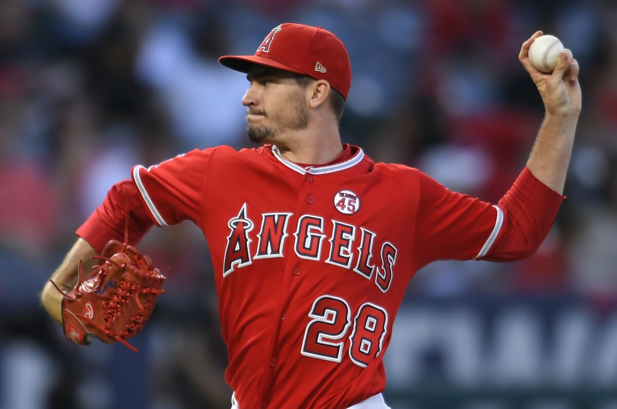 Angels pitcher Andrew Heaney delivers against the Texas Rangers in August.