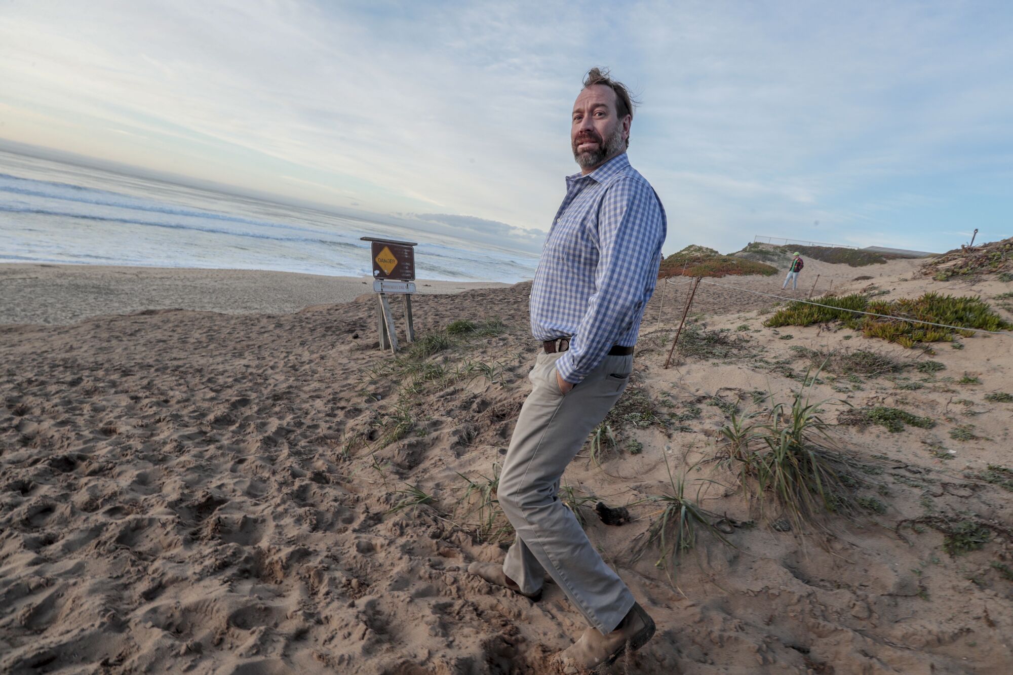 David Revell, a coastal geomorphologist who has consulted for a number of cities, including Marina, admires the coastline at Marina State Beach.