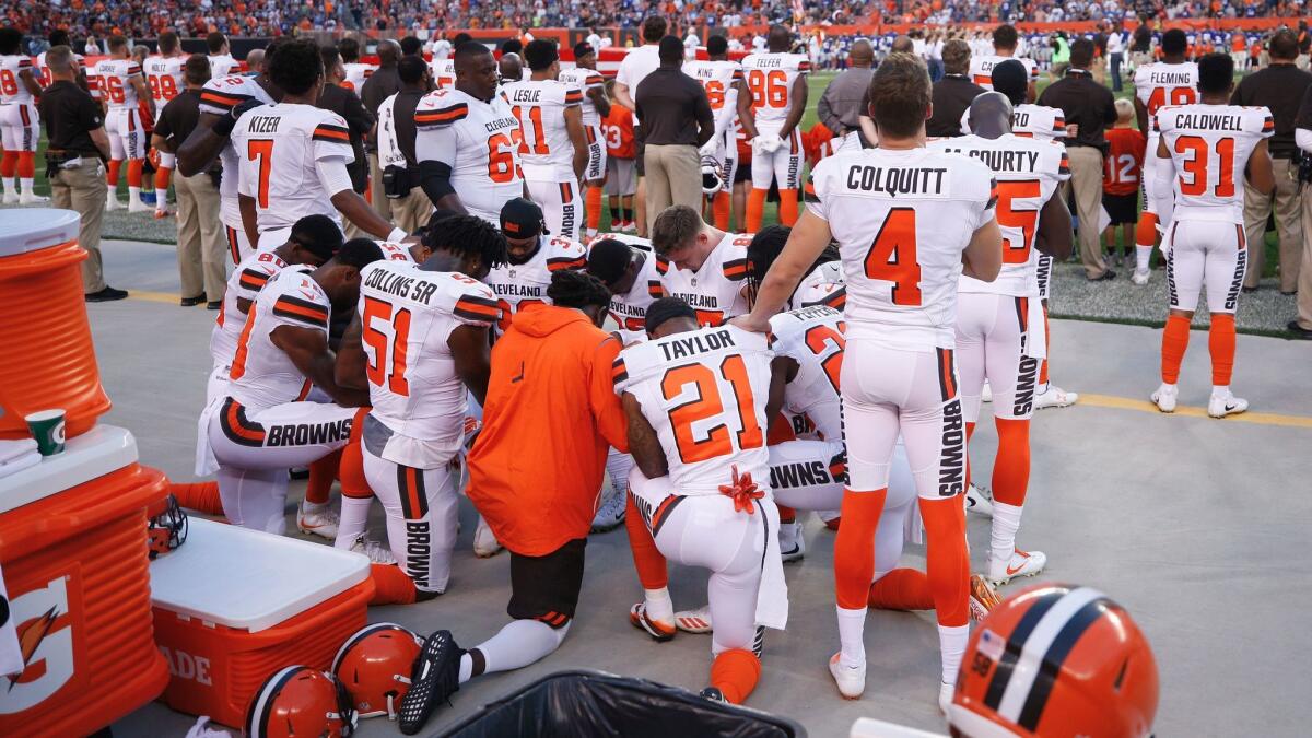 Several Cleveland players stood next to their kneeling teammates in a show of support.