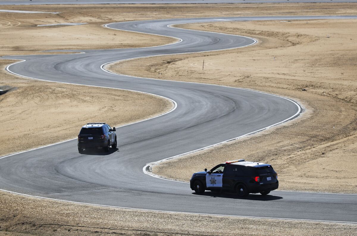 Sheriff's Department vehicles are driven on the new Emergency Vehicle Operations Center on Wednesday in Otay Mesa.