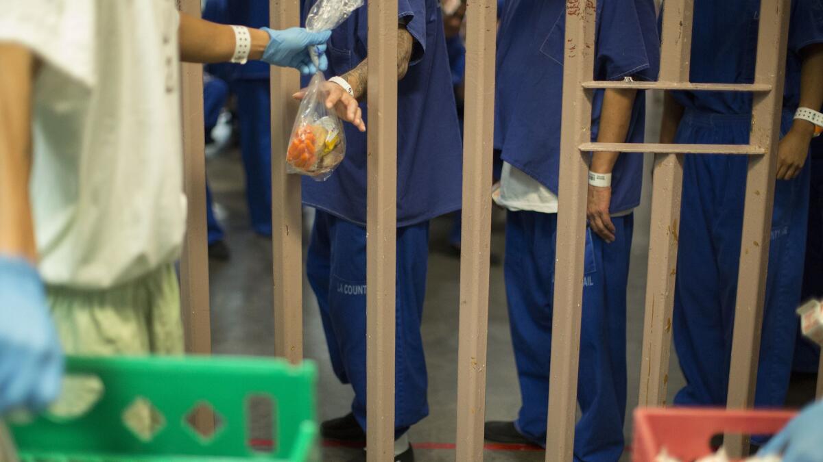 Inmates at the North County Correctional Facility in Castaic in October. An assault charge against Jonathan Grijalva, a former L.A. County sheriff's jail guard, was dismissed last week after prosecutors said they could not locate the man who had been attacked as a witness.