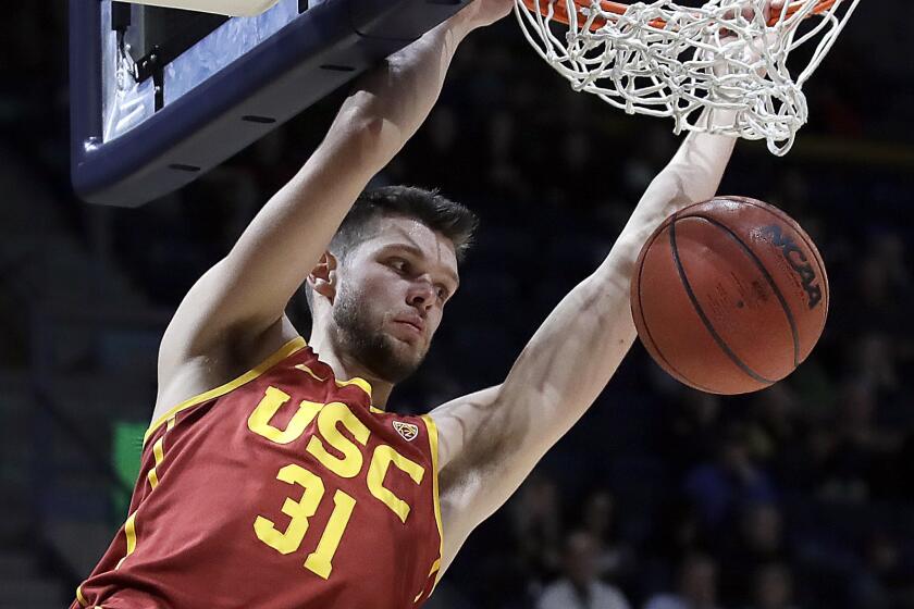 FILE - In this Saturday, Feb. 16, 2019, file photo, Southern California's Nick Rakocevic scores against California in the second half of an NCAA college basketball game in Berkeley, Calif. Rakocevic is one of the Pac-12's top returning big men. The senior averaged 14.7 points and 9.3 rebounds last season and his 15 double-doubles were second-most in the league. He shot 55 percent from the field, but will need to avoid the foul trouble that plagued him last season. (AP Photo/Ben Margot, File)