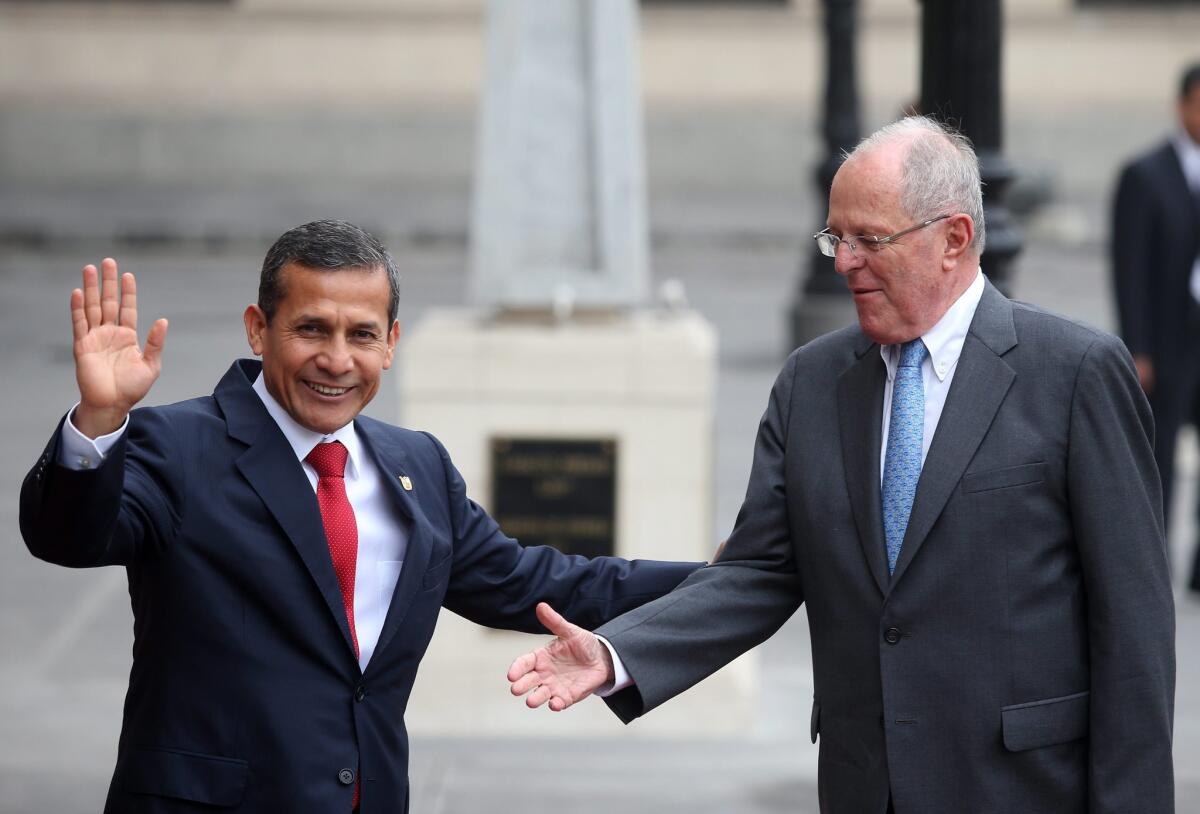 Peruvian President Ollanta Humala, left, receives Peruvian President-elect Pedro Pablo Kuczynski for a meeting and a private lunch at the Government Palace in Lima on June 22, 2016.