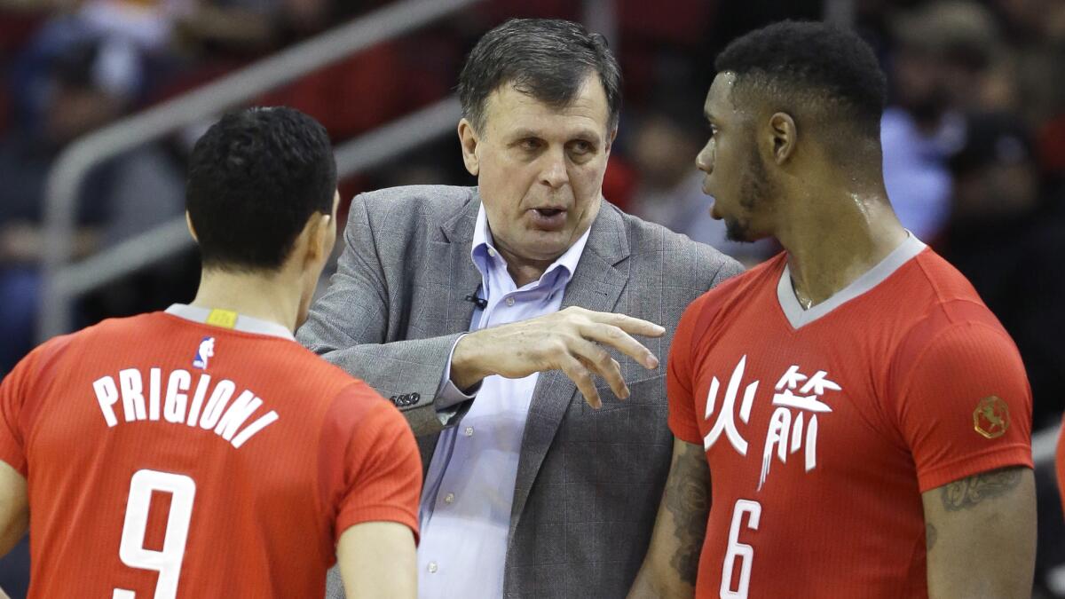 Houston Rockets Coach Kevin McHale, center, speaks with Pablo Prigioni, left, and Terrence Jones during the team's 110-105 win over the Clippers at Staples Center on Wednesday.