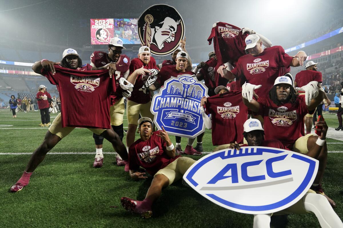 Florida State players pose after defeating Louisville in the ACC championship game on Dec. 2.