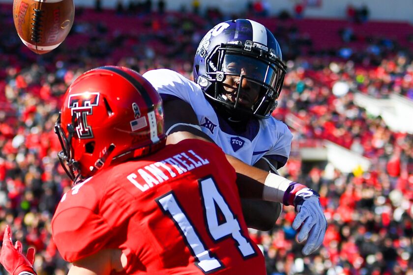 LUBBOCK, TX - NOVEMBER 18: Dylan Cantrell #14 of the Texas Tech Red Raiders has the ball knocked away by Jeff Gladney #12 of the TCU Horned Frogs during the game on November 18, 2017 at Jones AT&T Stadium in Lubbock, Texas. TCU defeated Texas Tech 27-3. (Photo by John Weast/Getty Images)
