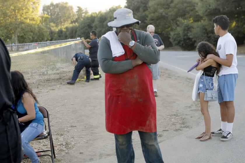 People leave the Gilroy Garlic Festival following a shooting in Gilroy, Calif., on Sunday, July 28, 2019. (Nhat V. Meyer/San Jose Mercury News via AP)