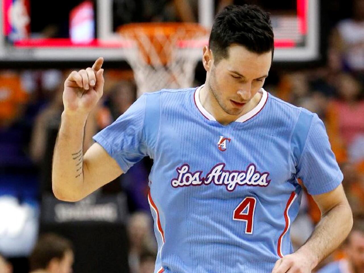 Clippers shooting guard J.J. Redick pumps his first after making a 3-pointer in the second half of a victory over the Suns.