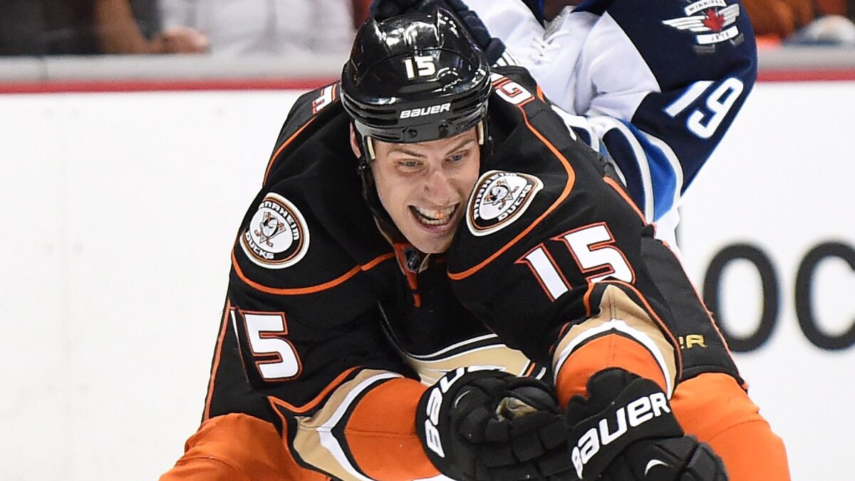 Ducks captain Ryan Getzlaf reaches for the puck during a 4-2 victory over the Winnipeg Jets in Game 1 of the NHL Western Conference quarterfinals on Thursday.