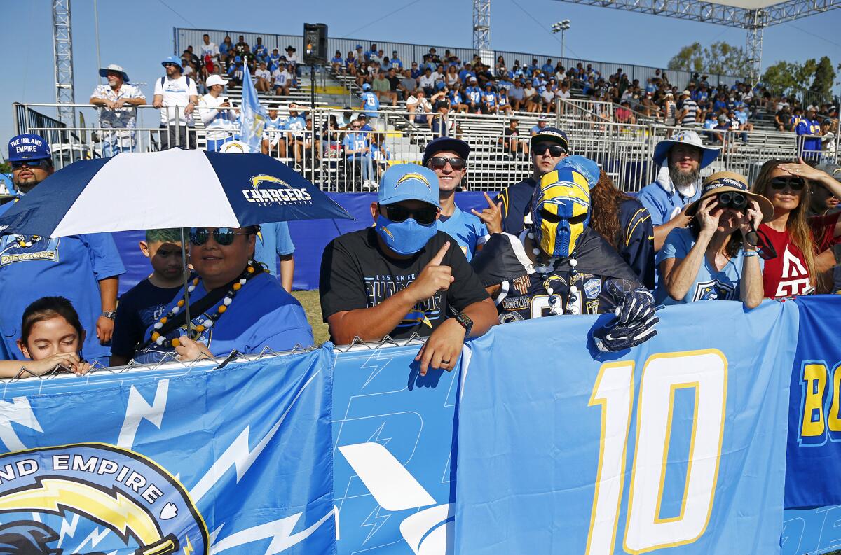 Fans look on from the sideline during Chargers training camp on July 28 at Jack Hammett Sports Complex in Costa Mesa.