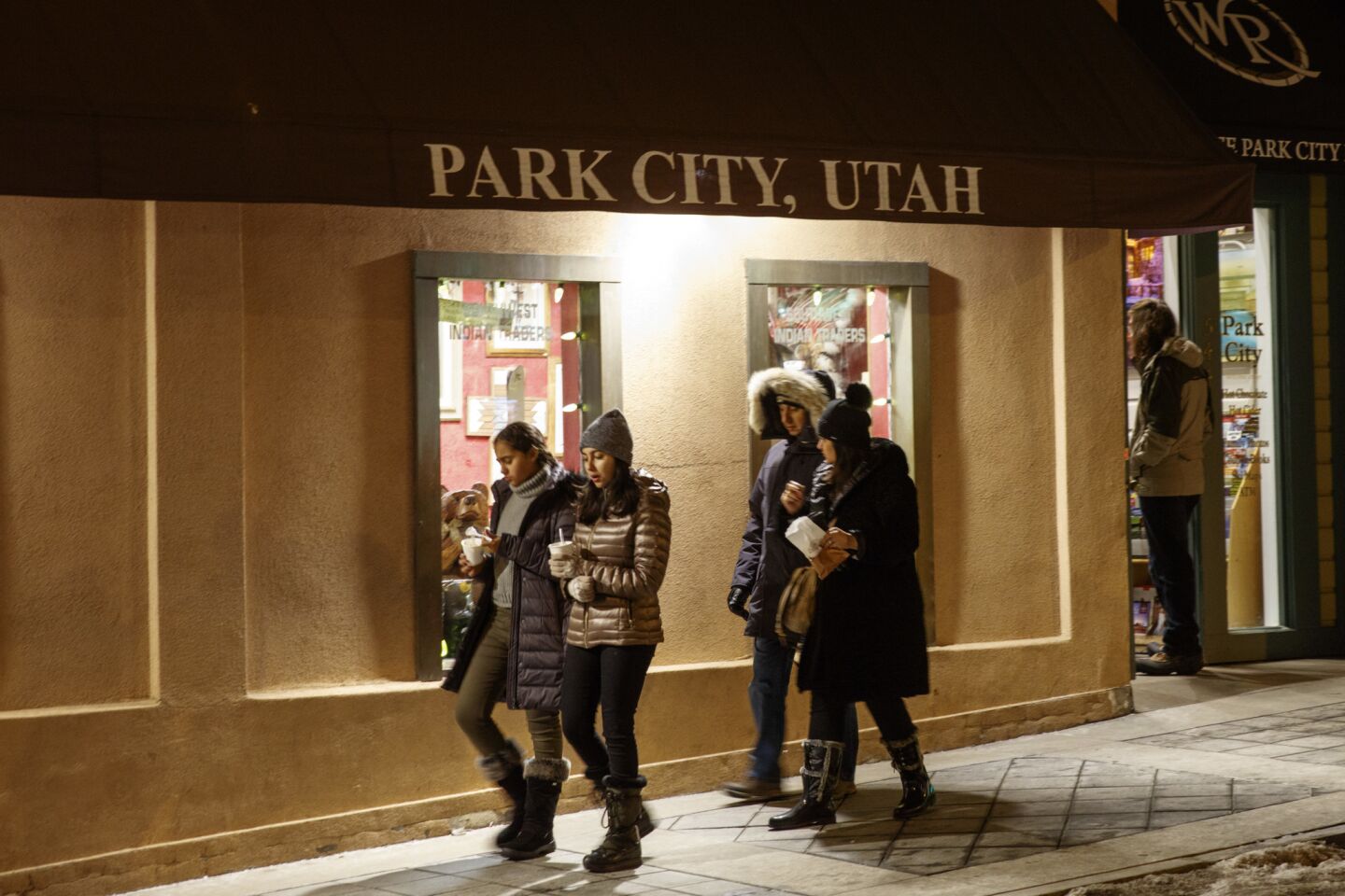 People are bundled up as temperatures dropped below 20 degrees along Main Street in Park City, Utah, as the start of the Sundance Film Festival approached.