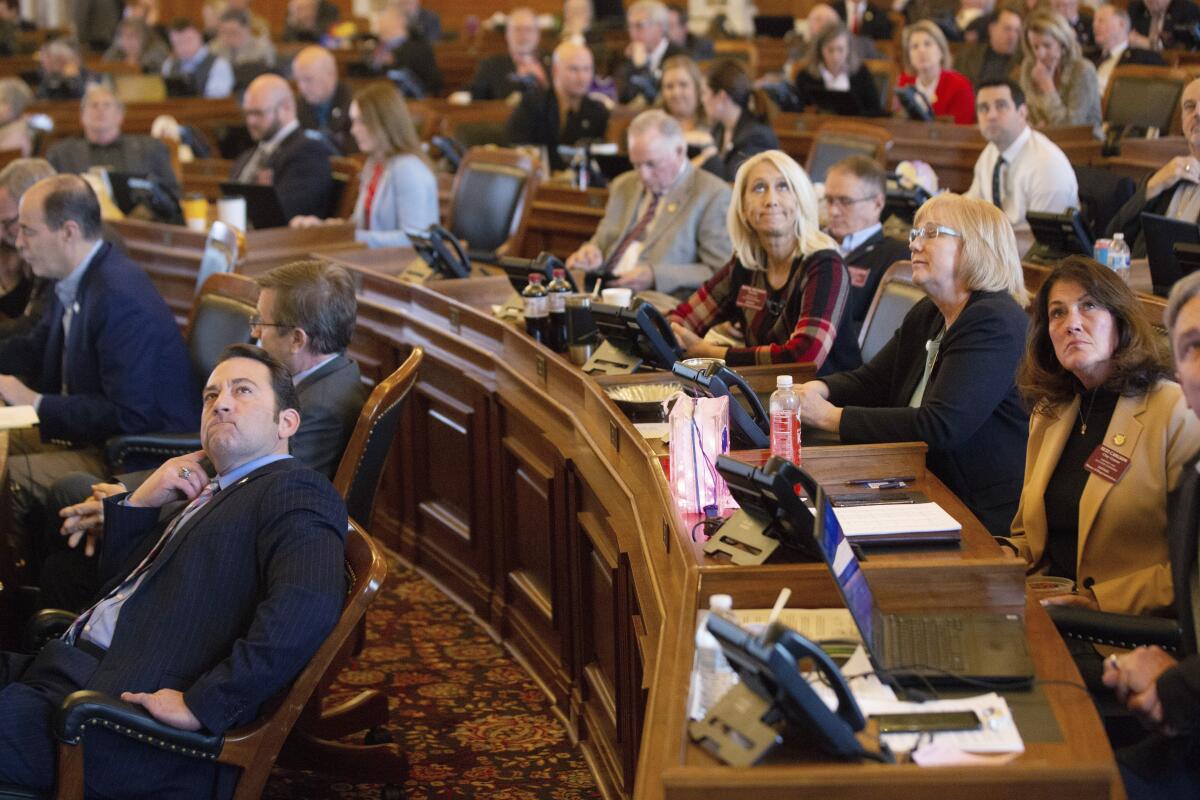 Kansas lawmakers watch as final votes are tallied Feb. 7 in Topeka. The House voted 80-43 against putting an antiabortion constitutional amendment on the ballot.