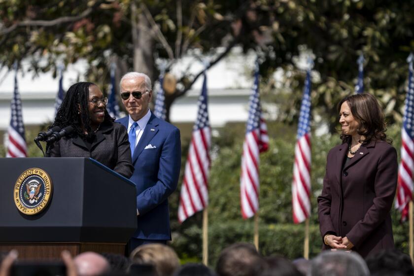 WASHINGTON, DC - APRIL 08: Judge Ketanji Brown Jackson turns back to look at Vice President Kamala Harris, while delivering remarks during an event on the South Lawn of the White House on April 08, 2022 in Washington, DC. Judge Jackson was confirmed yesterday to the Supreme Court of the United States - making history as the first Black woman to join its ranks - while leaving the ideological balance on the nation's highest court unchanged. (Kent Nishimura / Los Angeles Times)
