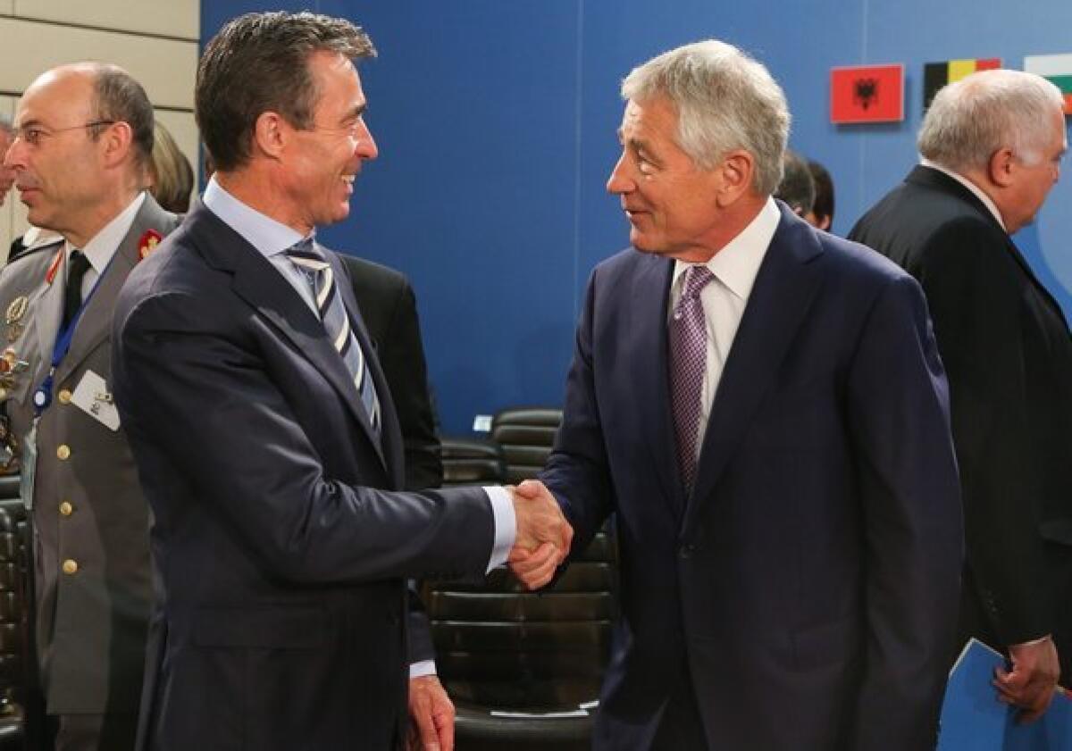 NATO Secretary-General Anders Fogh Rasmussen, left, and U.S. Defense Secretary Chuck Hagel at the start of a meeting of defense ministers at NATO headquarters in Brussels.