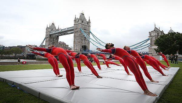 Elizabeth Streb's dancers perform in front of Tower Bridge in London as part of the Cultural Olympiad, a festival made up of 12,000 art and cultural events that honor the Summer Olympics. The troupe is from Brooklyn.