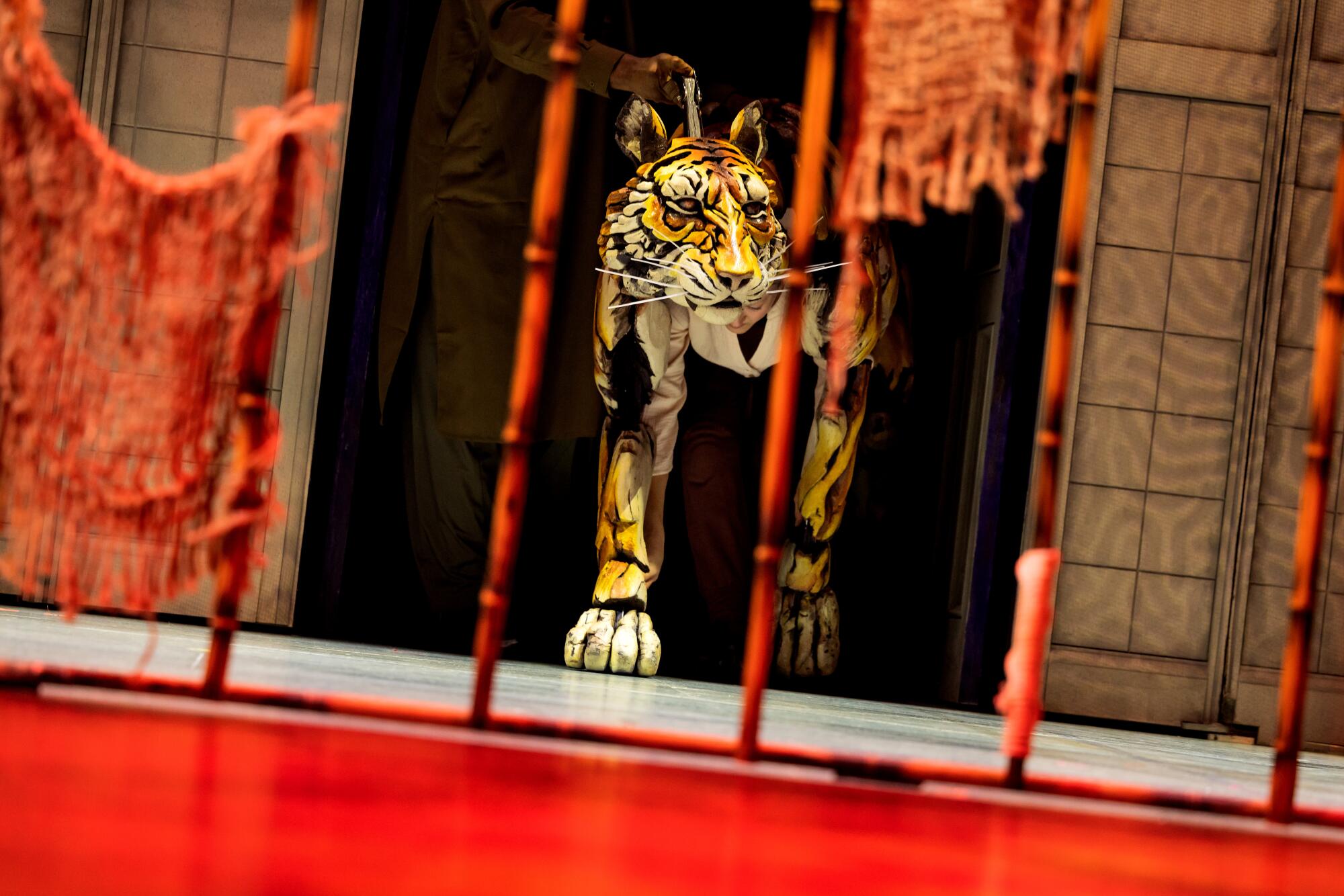 Puppeteers Anna Leigh Gortner, Shiloh Goodin and Toussaint Jeanlouis successful the nationalist circuit of "Life of Pi" astatine the Ahmanson.