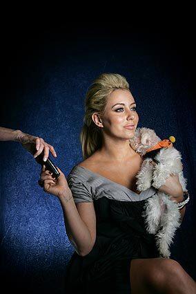 Aubrey O' Day of Danity Kane poses with her dog Ginger at the Four Seasons Beverly Hills.