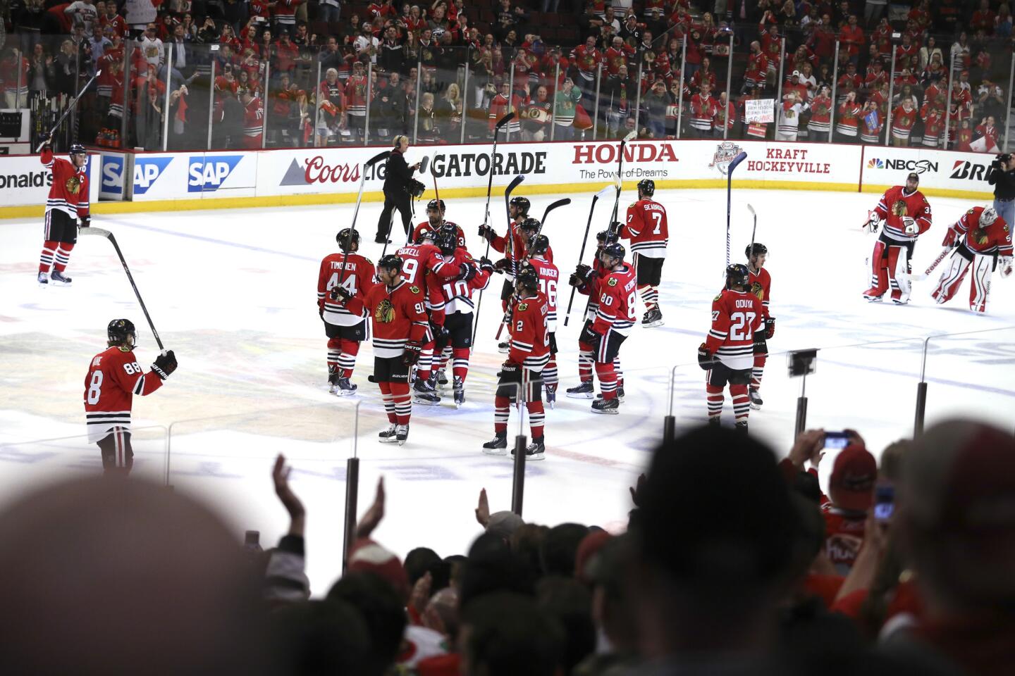 Patrick Kane and teammates after their 4-1 win.
