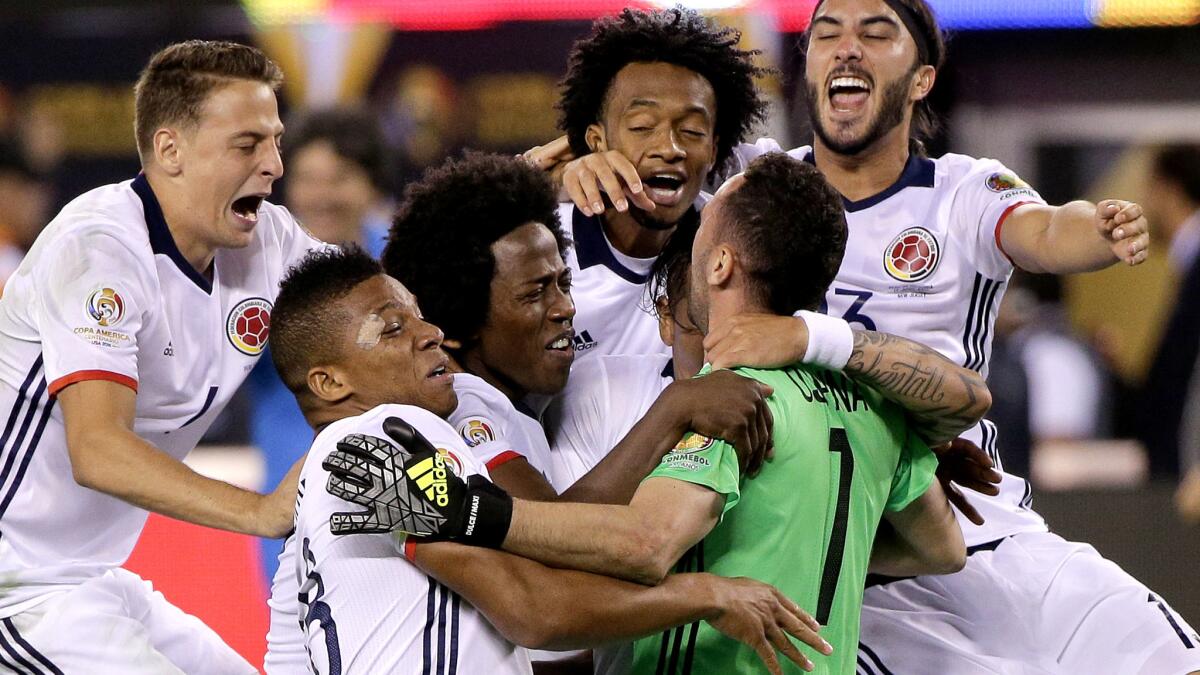 Colombia players celebrate their win over Peru in a Copa America quarterfinal soccer on Friday.
