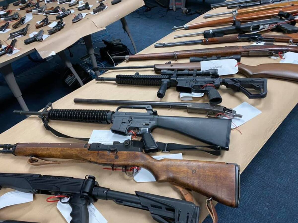 Guns arrayed on tables
