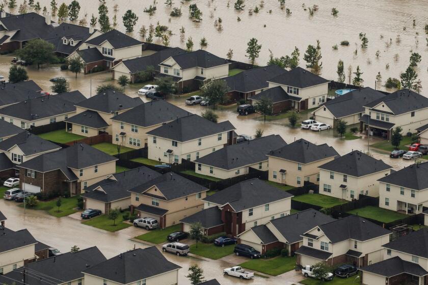 HOUSTON, TEXAS -- TUESDAY, AUGUST 29, 2017: Residential neighborhoods near the Interstate 10 sit in floodwater in the wake of Hurricane Harvey in Houston, Texas, on Aug. 29, 2017. (Marcus Yam / Los Angeles Times)